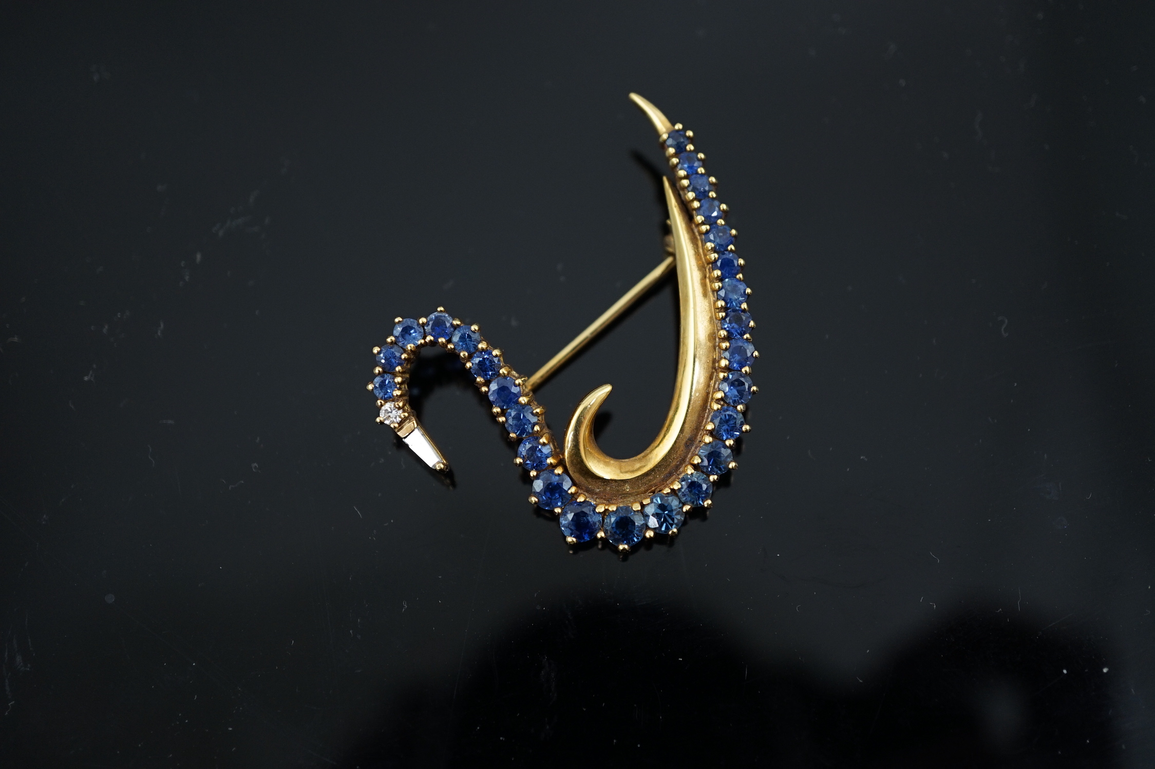 A 1990's 18ct gold, sapphire and diamond cluster brooch, modelled as a swan